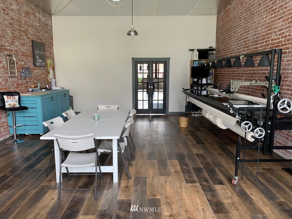 358 East Main Street Dayton, WA 99328 - Photo 21 of 34 a large kitchen with a table chairs and flat screen tv