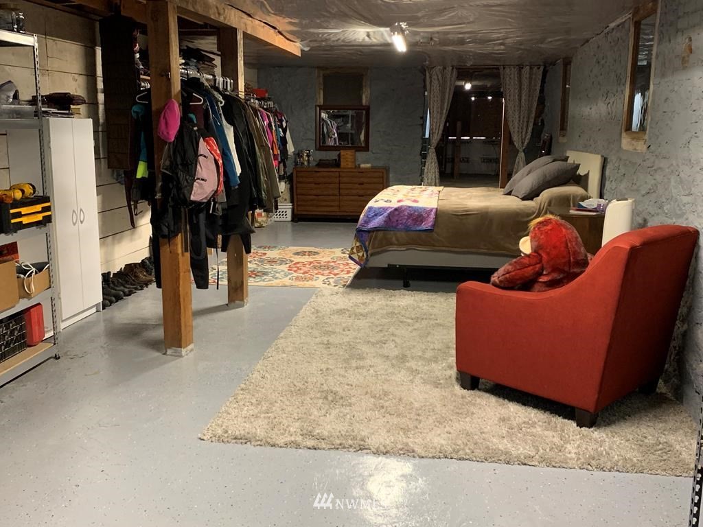 358 East Main Street Dayton, WA 99328 - Photo 27 of 34 a bed room with furniture and a walk in closet