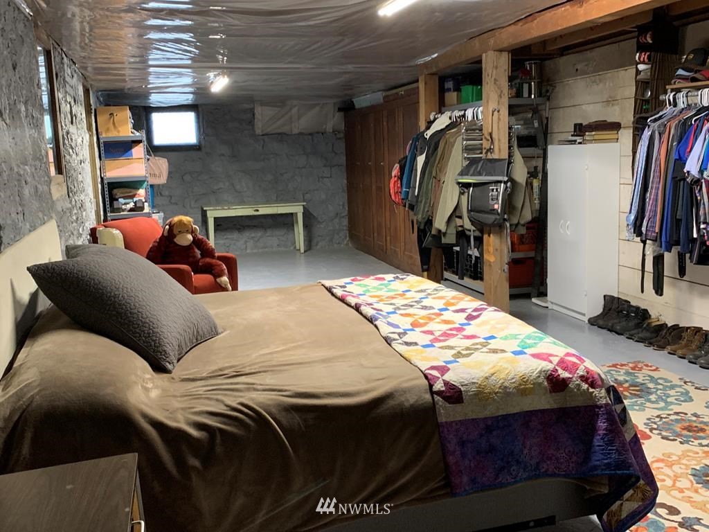 358 East Main Street Dayton, WA 99328 - Photo 28 of 34 a bedroom with a bed and a walk in closet