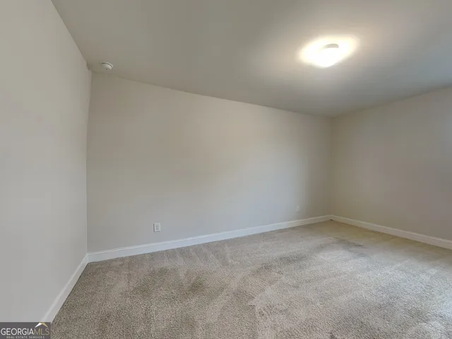 a view of empty room with windows