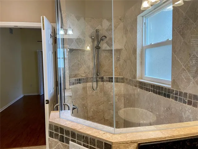 a white bath tub sitting in a bathroom