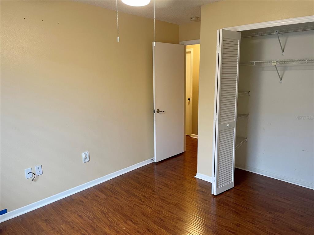 2564 Islander Court Palm Harbor, FL 34683 - Photo 15 of 21 a view of a room with wooden floor