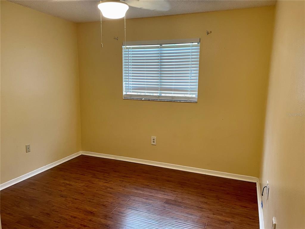 2564 Islander Court Palm Harbor, FL 34683 - Photo 16 of 21 a view of a small space with wooden floor and a window