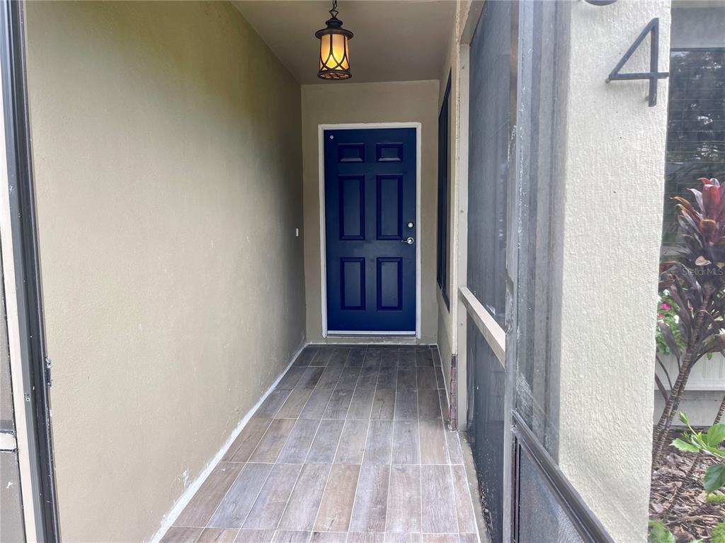 2564 Islander Court Palm Harbor, FL 34683 - Photo 2 of 21 a view of hallway with wooden floor