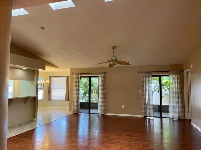 a view of an entryway with wooden floors