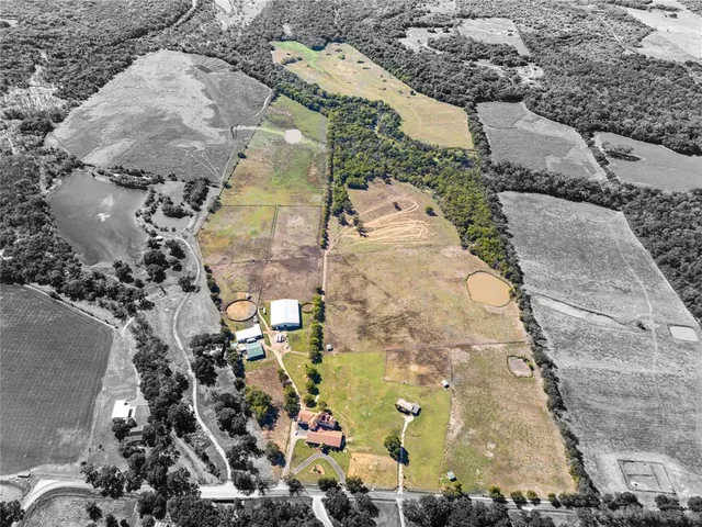 a view of a swimming pool with an outdoor seating