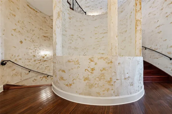 a bedroom with furniture and a lamp