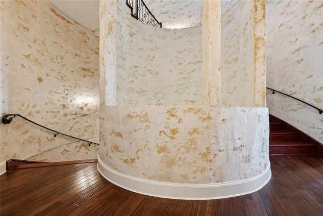 a bedroom with furniture and a lamp