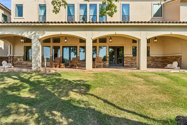 a view of a hallway with wooden floor and entryway