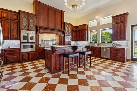 a kitchen with stainless steel appliances a sink and a counter top space