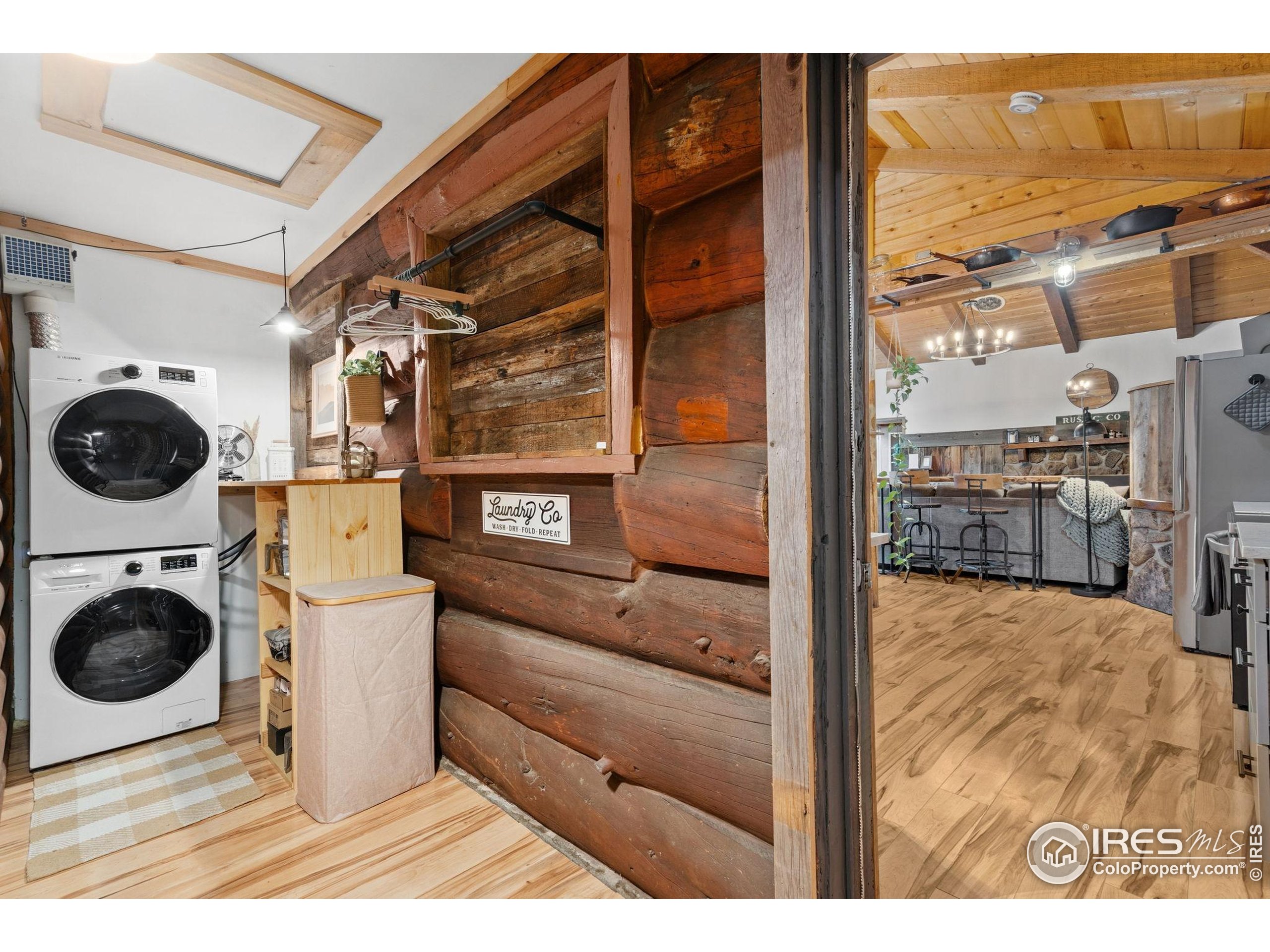 32224 Poudre Canyon Road Bellvue, CO 80512 - Photo 25 of 34 a view of a living room and washer and dryer