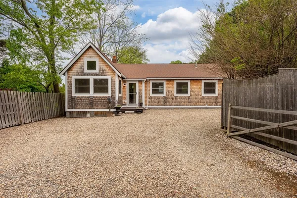 a front view of a house with yard