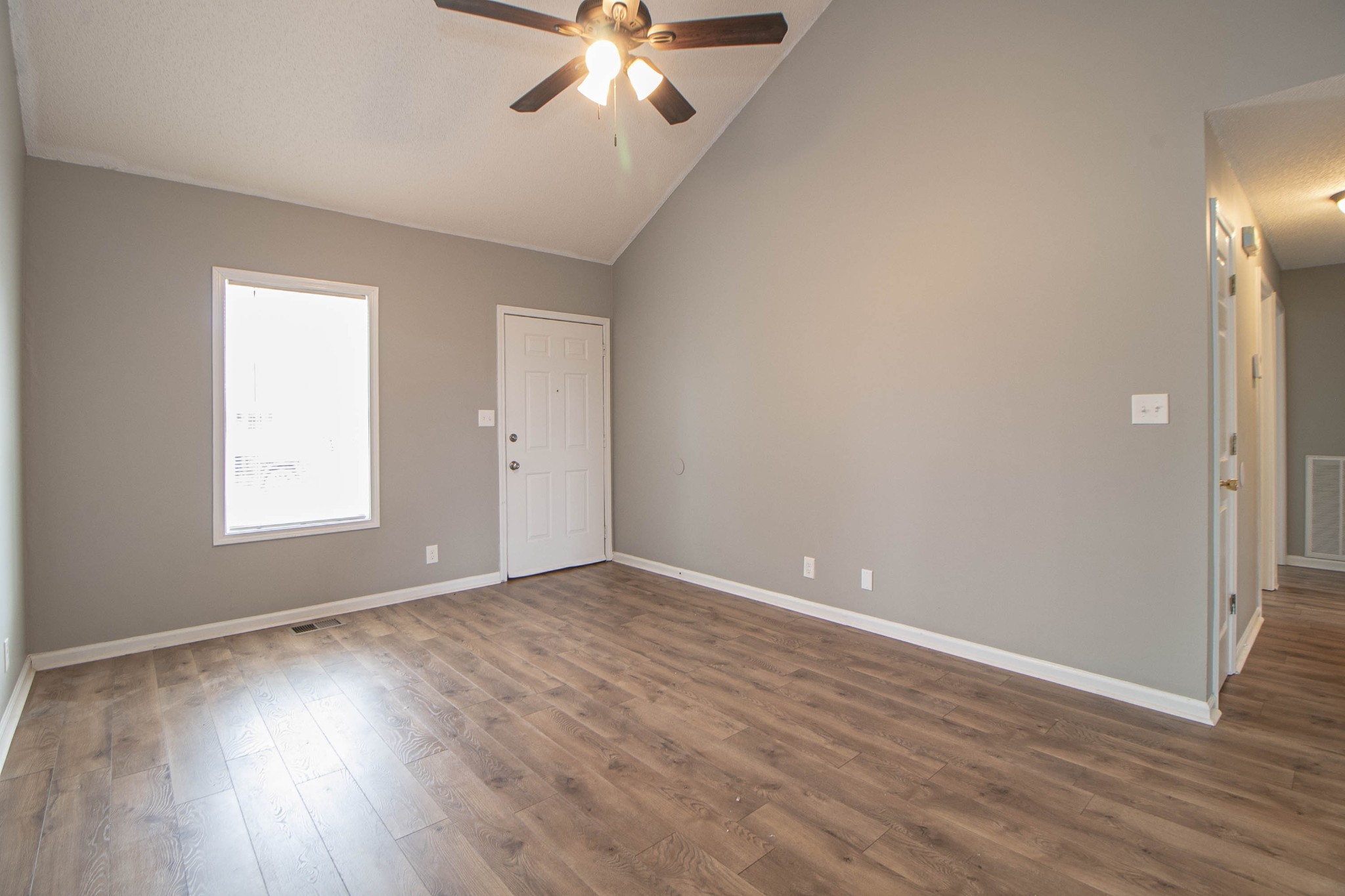 1913 Timberline Circle Oak Grove, KY 42262 - Photo 4 of 25 a view of an empty room with wooden floor and a window