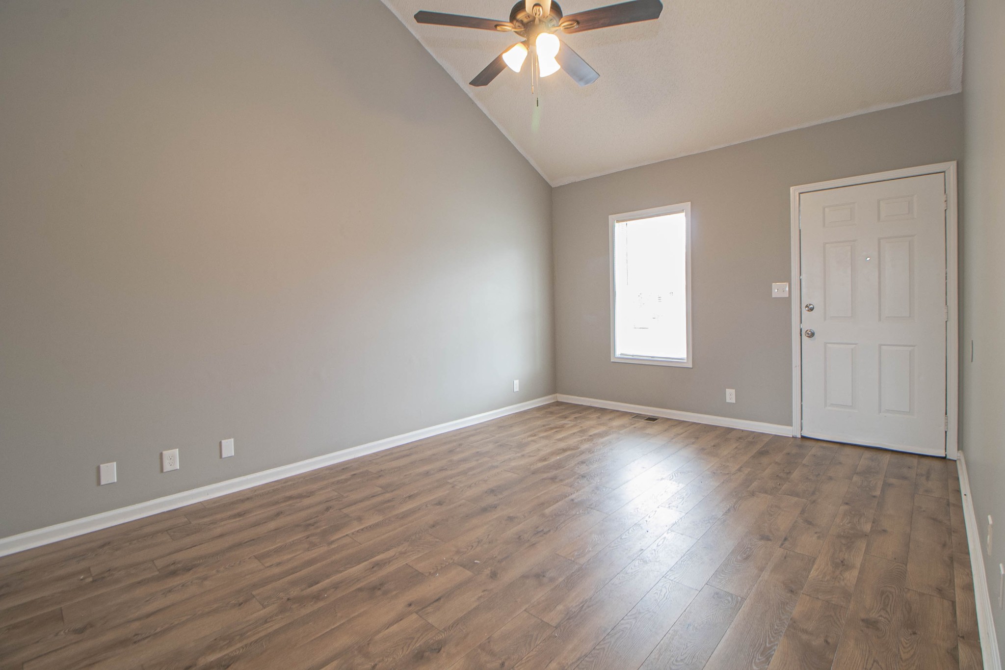 1913 Timberline Circle Oak Grove, KY 42262 - Photo 5 of 25 a view of an empty room with wooden floor and a window