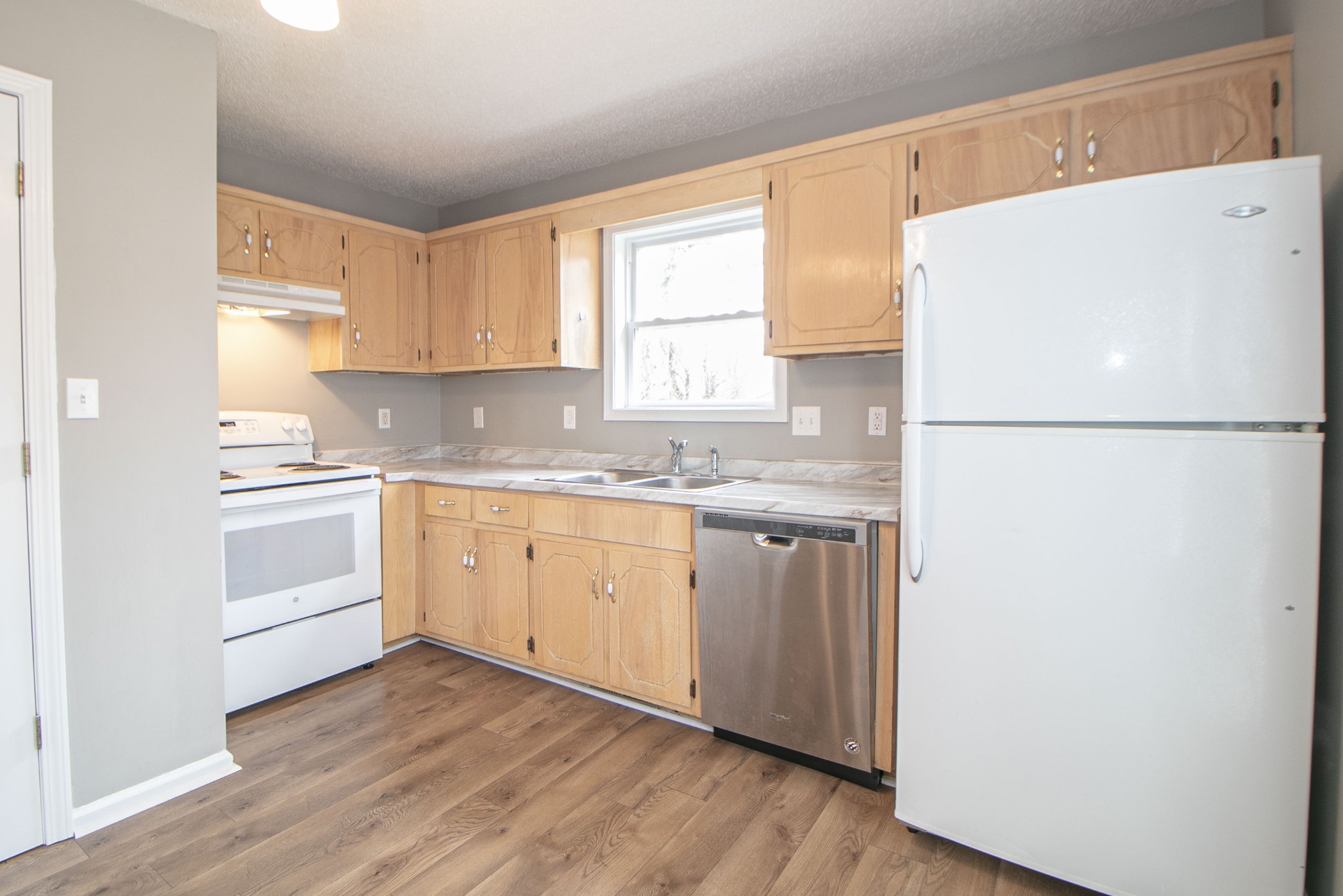 1913 Timberline Circle Oak Grove, KY 42262 - Photo 7 of 25 a white refrigerator freezer sitting in a kitchen with white cabinets