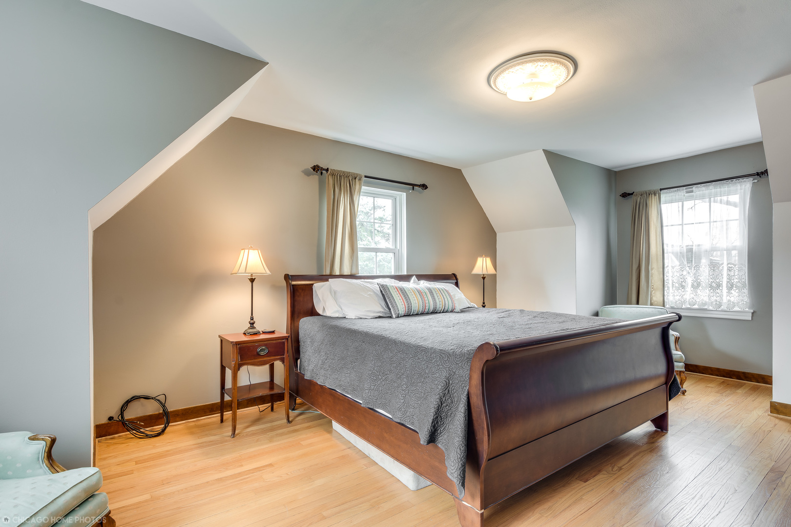 583 Selborne Road Riverside, IL 60546 - Photo 14 of 28 a bedroom with a bed a lamp and window