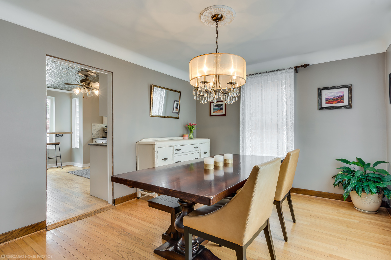 583 Selborne Road Riverside, IL 60546 - Photo 9 of 28 a view of a dining room with furniture wooden floor and chandelier