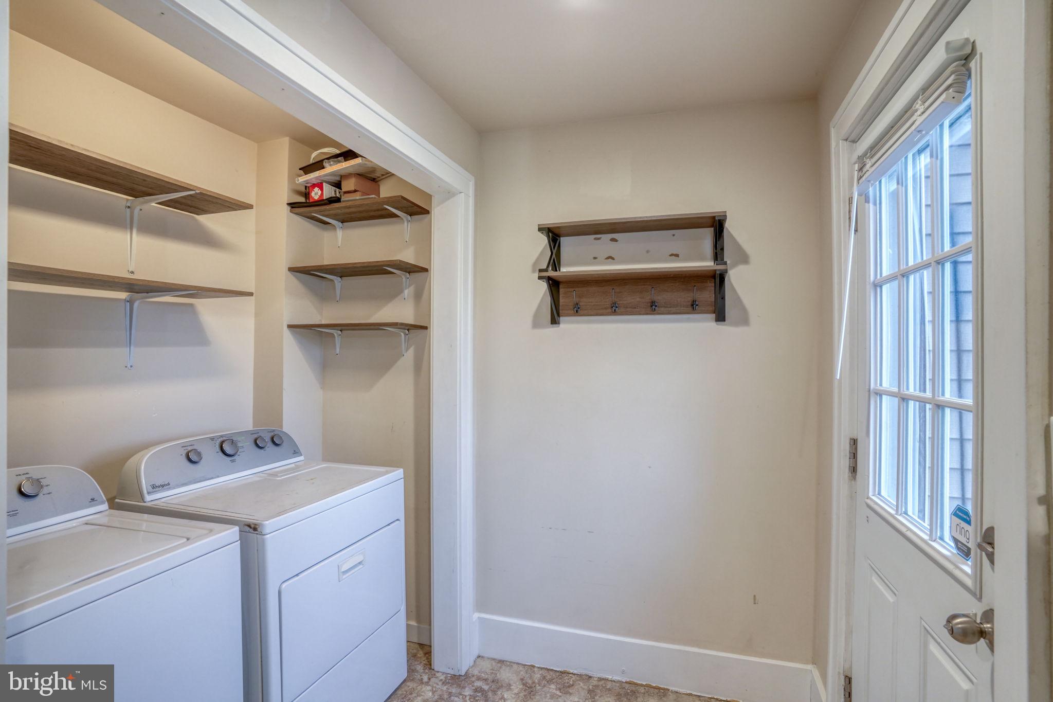 129 Laurel Road Millsboro, DE 19966 - Photo 18 of 40 a view of storage and utility room with racks on the wall