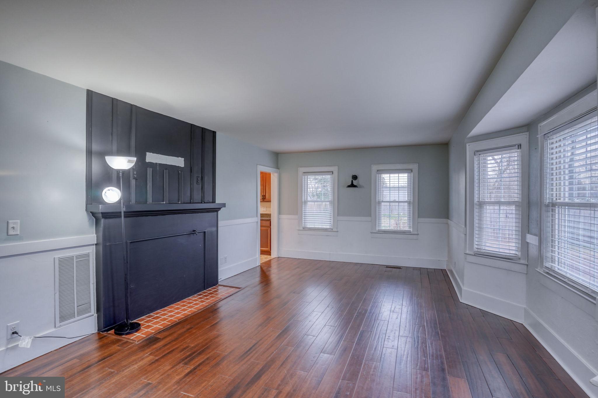 129 Laurel Road Millsboro, DE 19966 - Photo 23 of 40 wooden floor in an empty room with a window