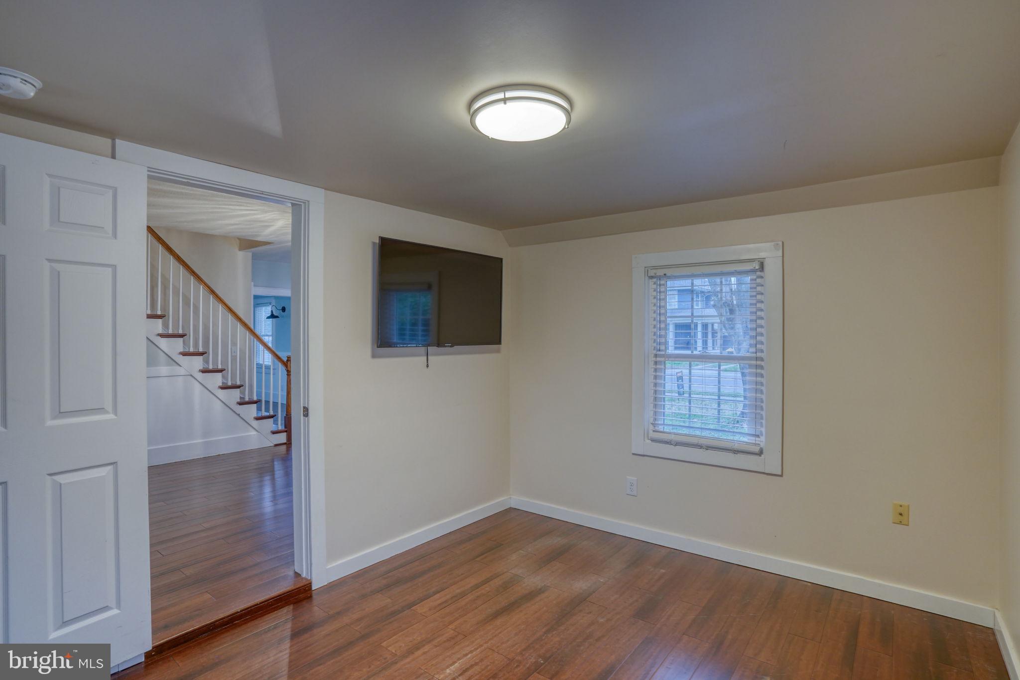 129 Laurel Road Millsboro, DE 19966 - Photo 26 of 40 a view of an entryway with wooden floor and staircase