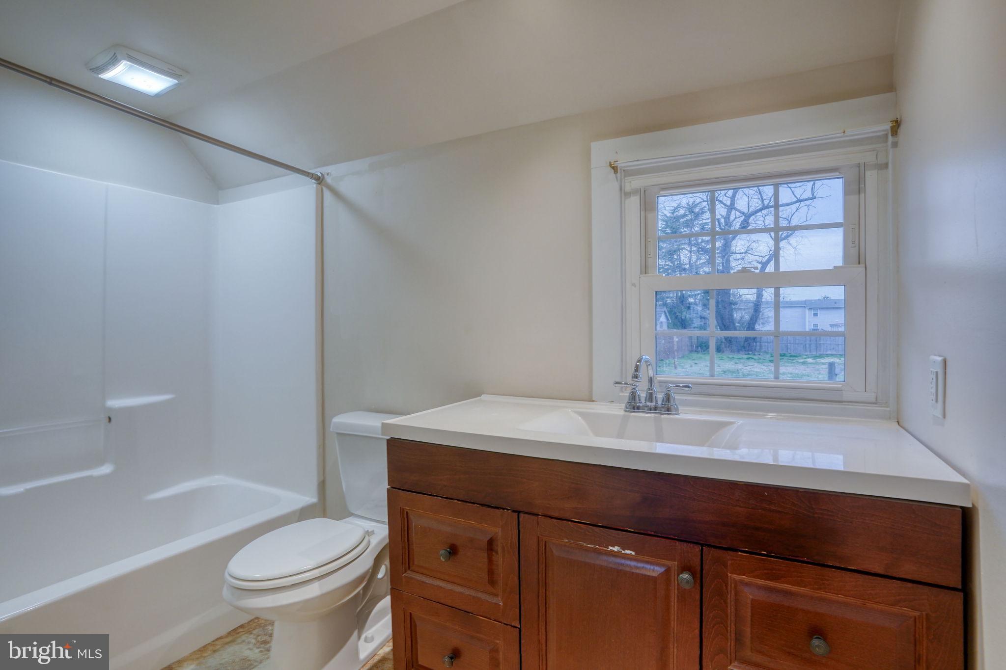 129 Laurel Road Millsboro, DE 19966 - Photo 27 of 40 a bathroom with a sink a toilet and shower