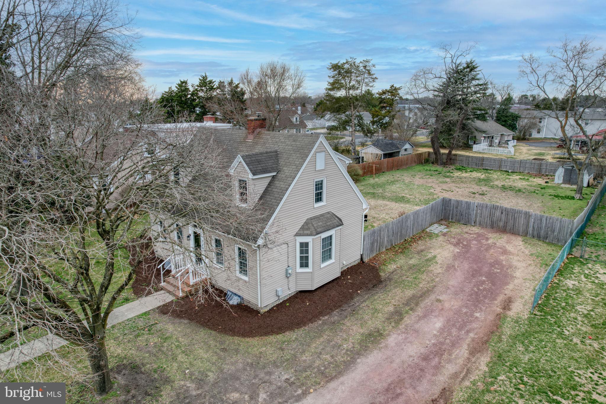 129 Laurel Road Millsboro, DE 19966 - Photo 3 of 40 a view of a house with a yard