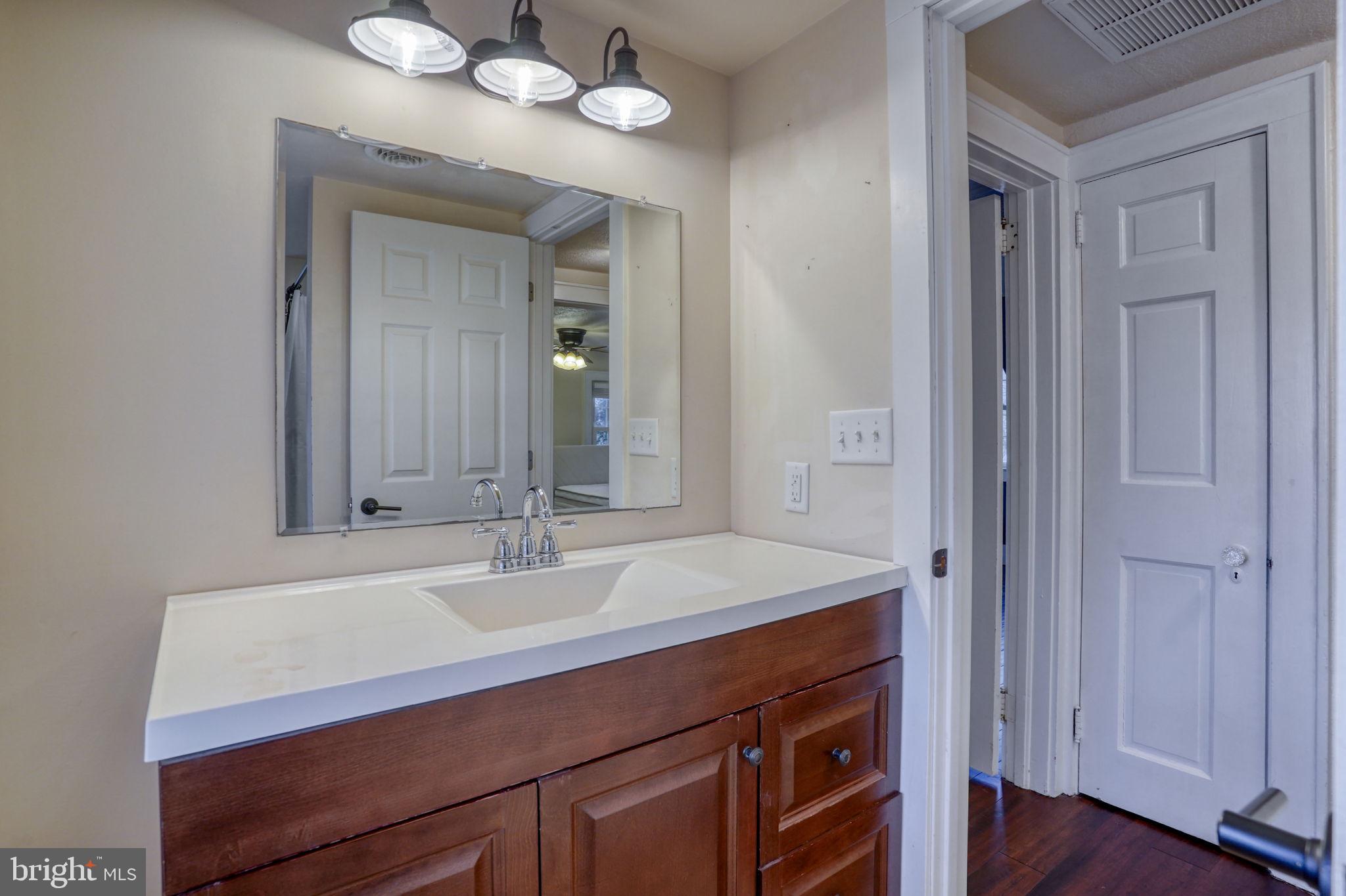 129 Laurel Road Millsboro, DE 19966 - Photo 32 of 40 a sink with a mirror