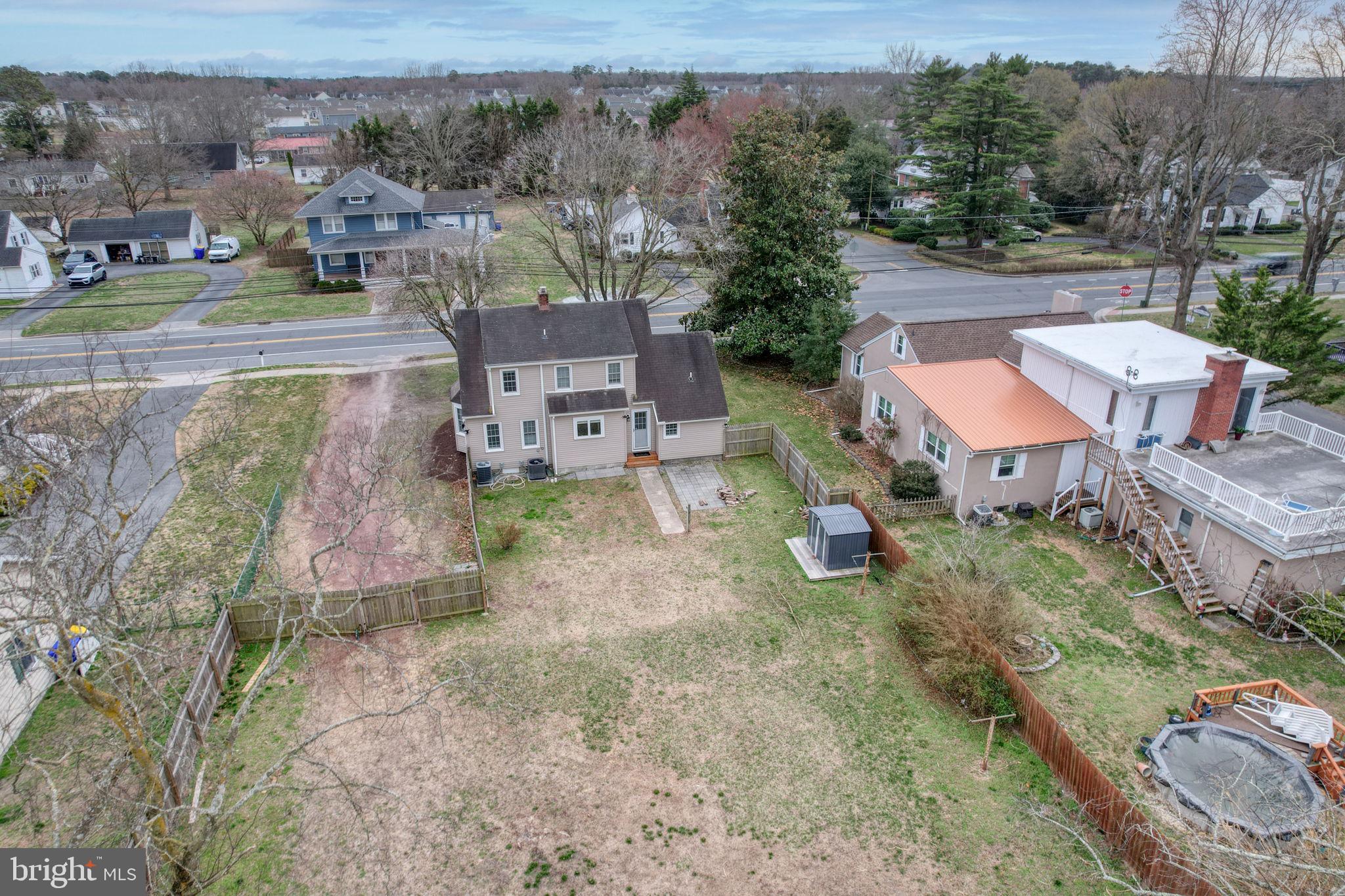 129 Laurel Road Millsboro, DE 19966 - Photo 6 of 40 an aerial view of a house with garden space and street view