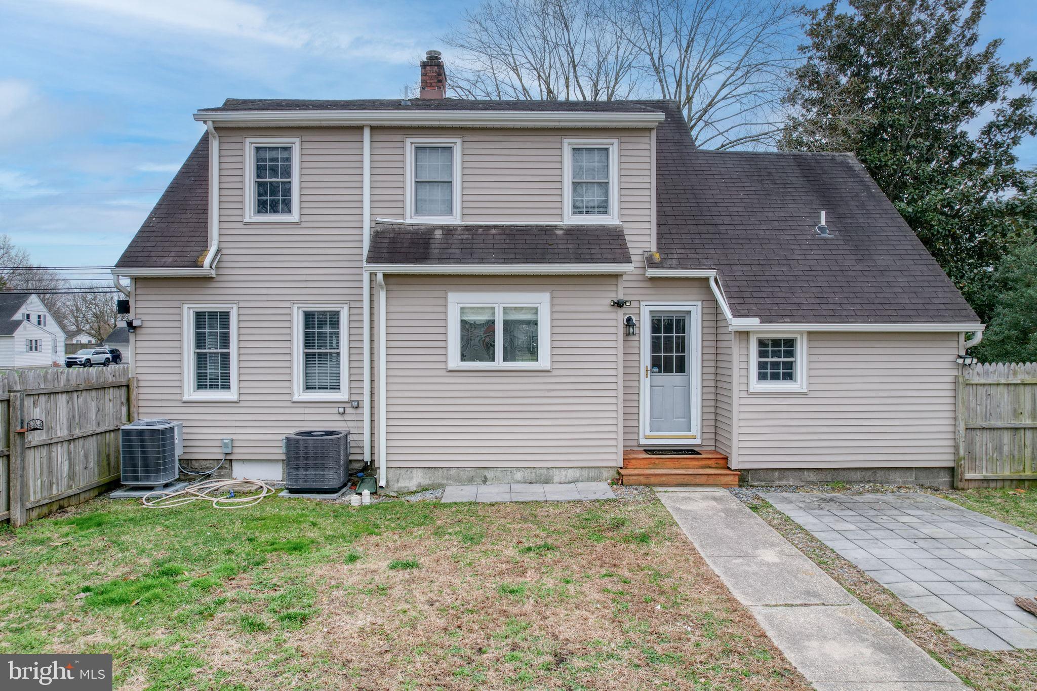 129 Laurel Road Millsboro, DE 19966 - Photo 7 of 40 a front view of a house with a yard