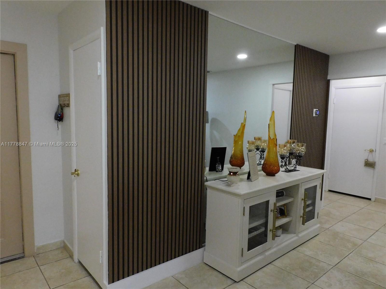 6936 Holly Road Miami Lakes, FL 33014 - Photo 13 of 43 Living room accent wall decor.