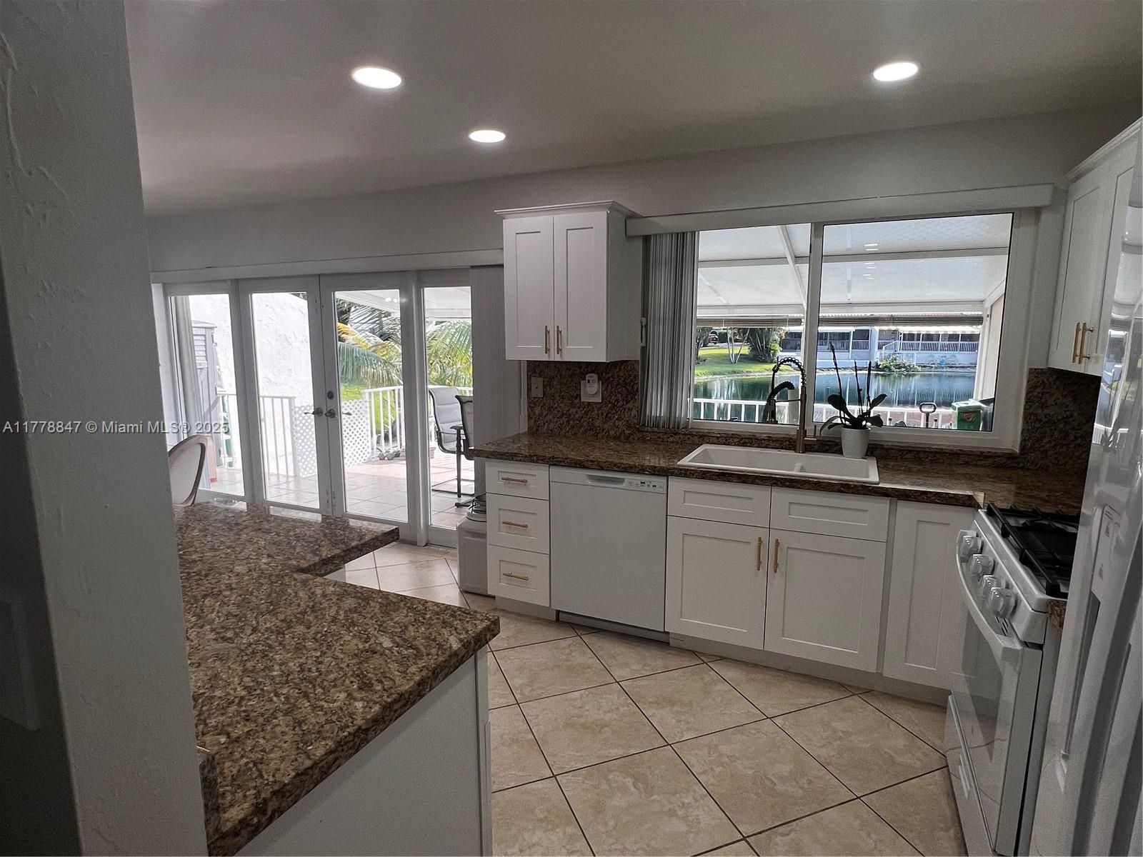 6936 Holly Road Miami Lakes, FL 33014 - Photo 17 of 43 Kitchen with views to Lake Martha.