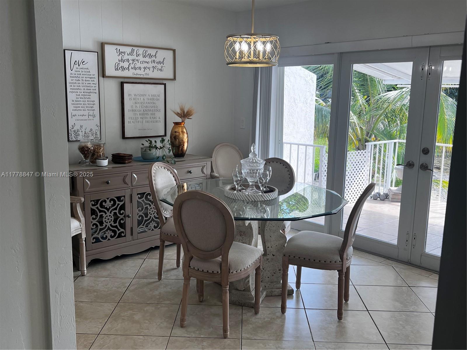 6936 Holly Road Miami Lakes, FL 33014 - Photo 19 of 43 Dining area overlooking the lake.