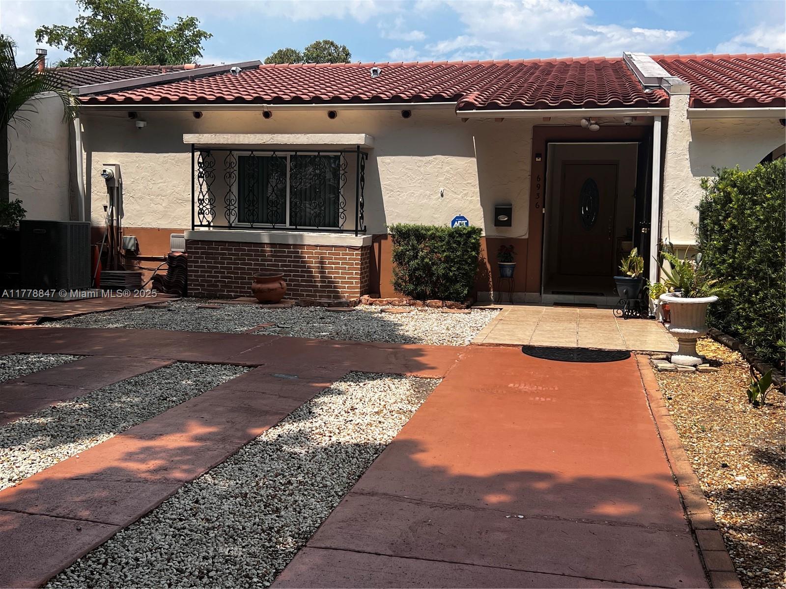 6936 Holly Road Miami Lakes, FL 33014 - Photo 3 of 43 Impact windows/tile roof is 12.5 years - plenty of life.