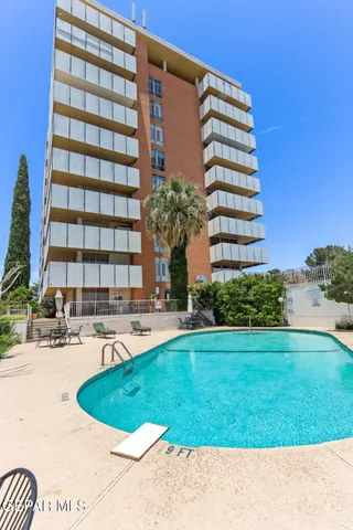 a kitchen with a sink a stove and cabinets