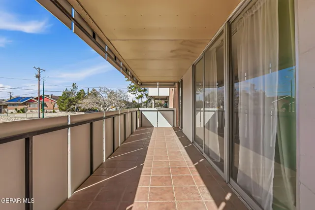 a bedroom with a bed and a desk