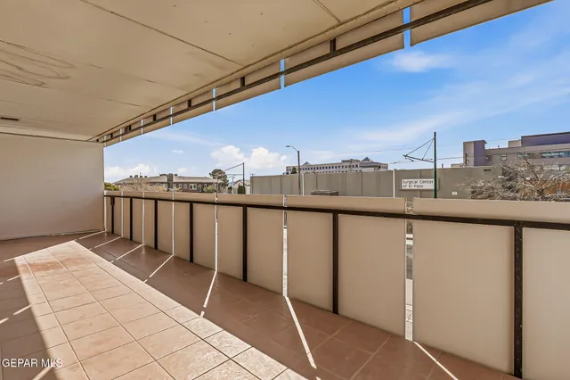 a room that has a bed and a mirror in it