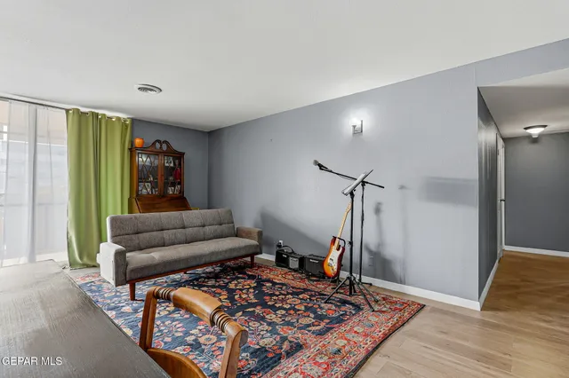 a bed room with a bed and a chandelier