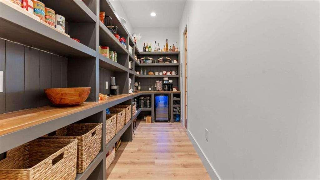 28 Ravenfield Road Taylorsville, GA 30178 - Photo 11 of 38 a hallway with lots of wooden cabinets