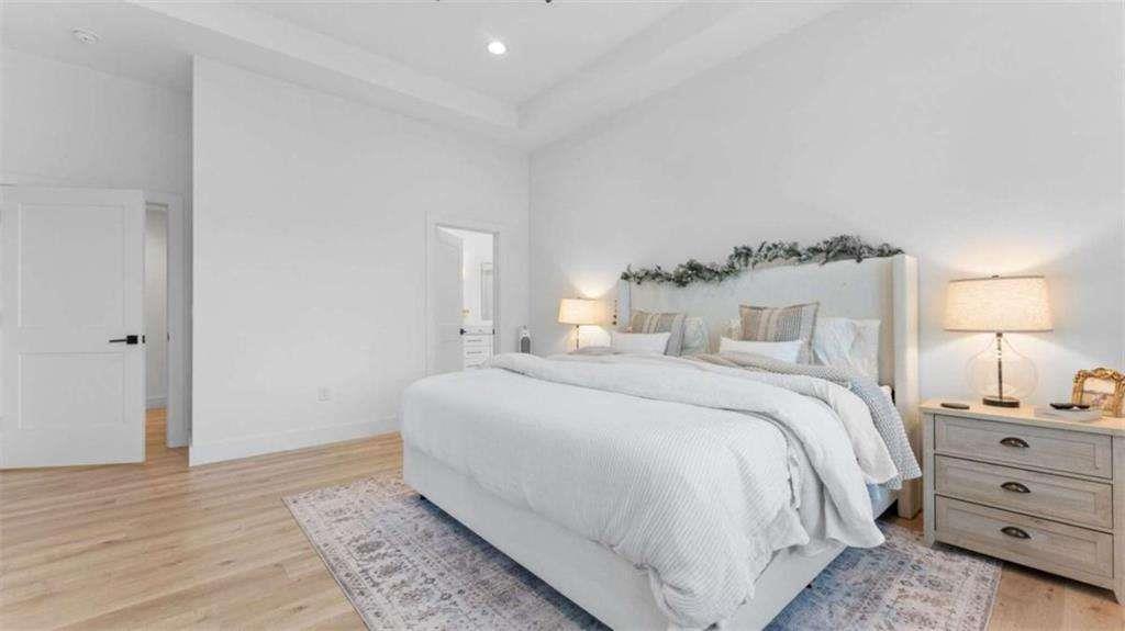 28 Ravenfield Road Taylorsville, GA 30178 - Photo 16 of 38 a bedroom with a bed and a lamp on dresser