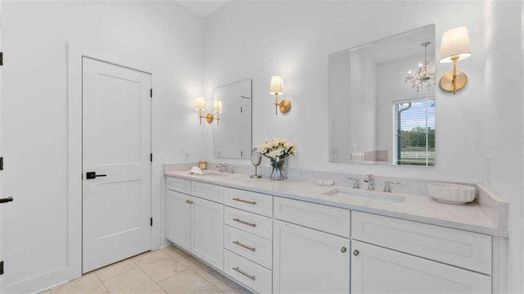 28 Ravenfield Road Taylorsville, GA 30178 - Photo 17 of 38 a bathroom with a granite countertop sink mirror and vanity