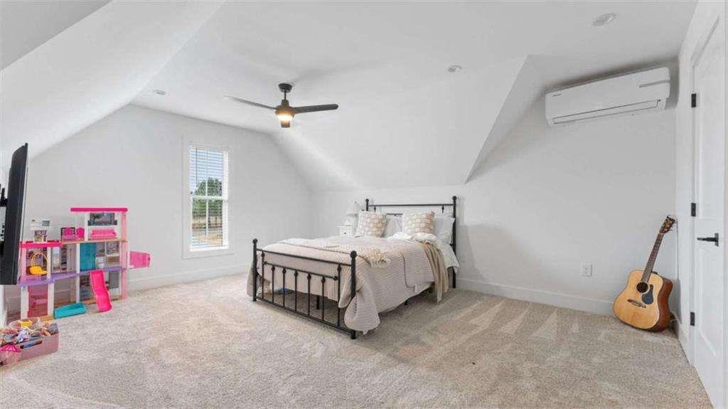28 Ravenfield Road Taylorsville, GA 30178 - Photo 20 of 38 a bed room with a bed and a ceiling fan
