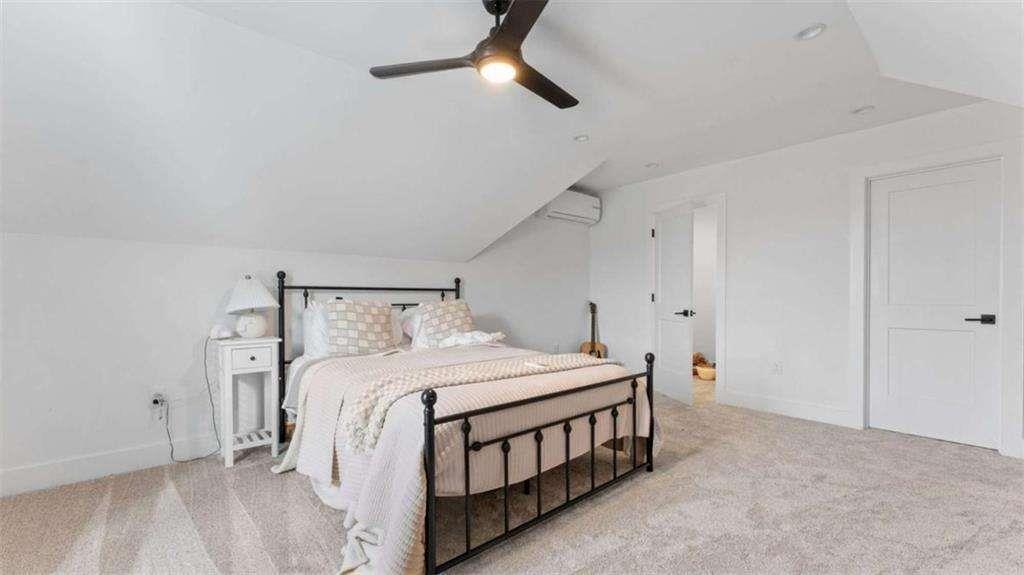 28 Ravenfield Road Taylorsville, GA 30178 - Photo 21 of 38 a bedroom with a bed and a chandelier