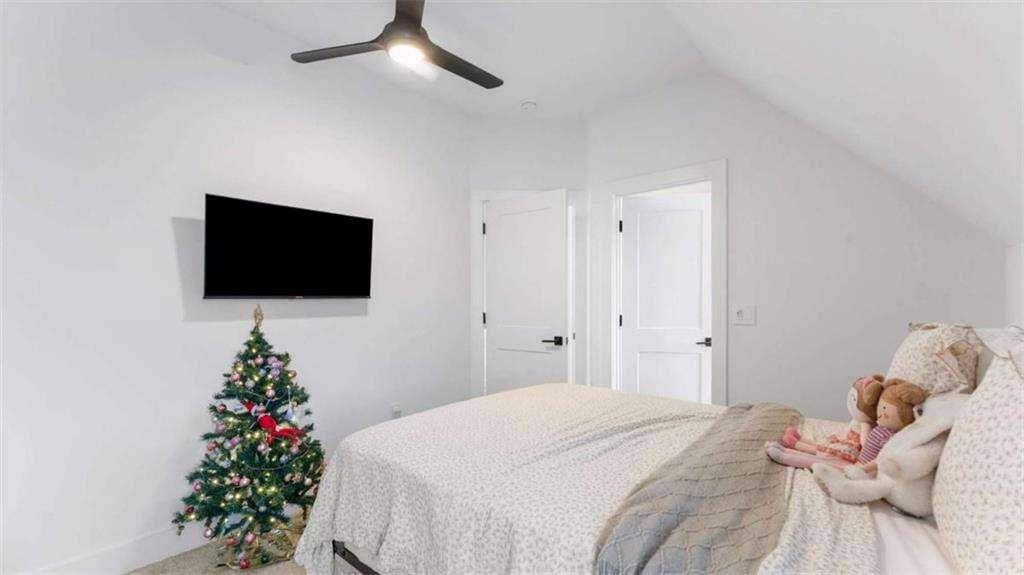 28 Ravenfield Road Taylorsville, GA 30178 - Photo 26 of 38 a bedroom with a bed and a flat screen tv