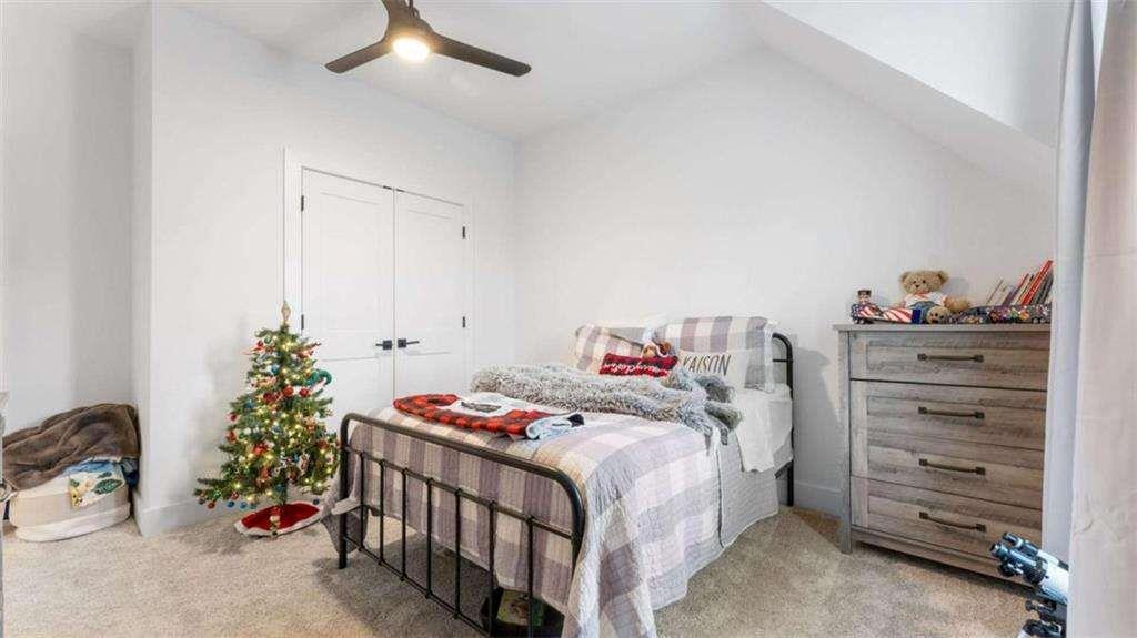 28 Ravenfield Road Taylorsville, GA 30178 - Photo 30 of 38 a bedroom with a bed and a dresser