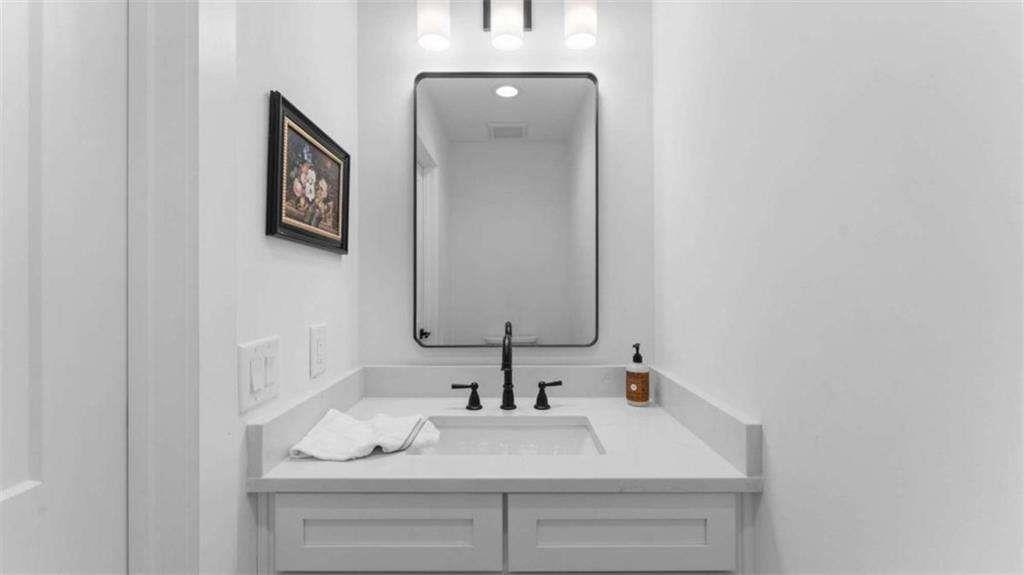 28 Ravenfield Road Taylorsville, GA 30178 - Photo 31 of 38 a bathroom with a sink and a mirror