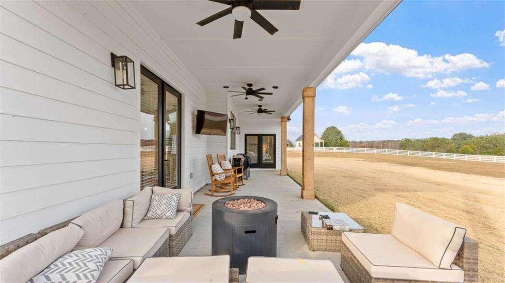 28 Ravenfield Road Taylorsville, GA 30178 - Photo 34 of 38 a view of a balcony with furniture and chandelier