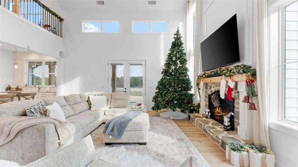 28 Ravenfield Road Taylorsville, GA 30178 - Photo 7 of 38 a living room with furniture and a flat screen tv