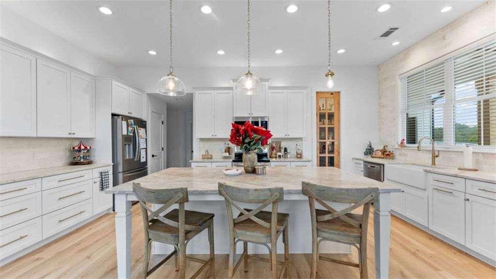 28 Ravenfield Road Taylorsville, GA 30178 - Photo 8 of 38 a dining room filled chandelier and kitchen view