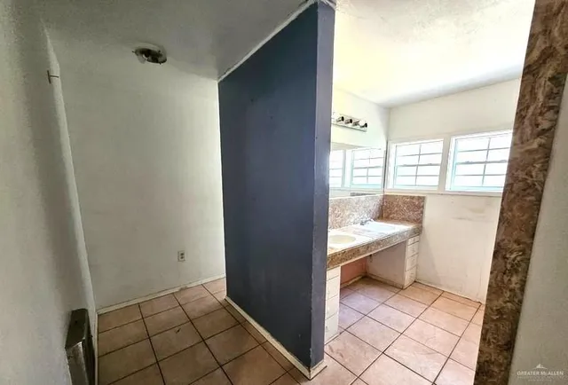 a bathroom with a sink a toilet and bathtub