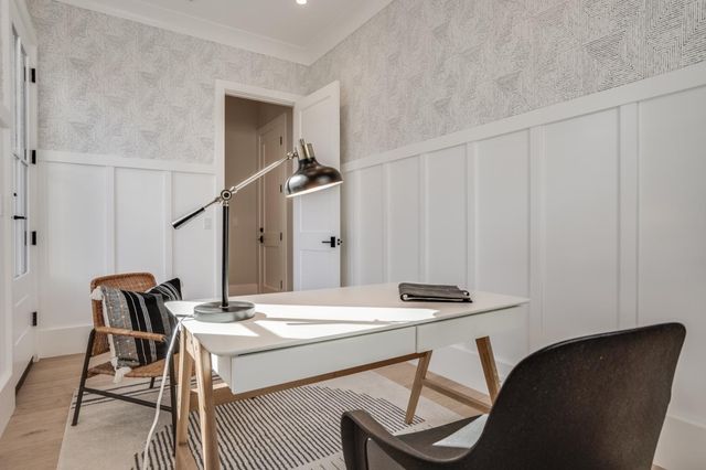 a bathroom with a granite countertop sink a toilet and a mirror
